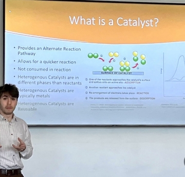 Student presentation at whiteboard